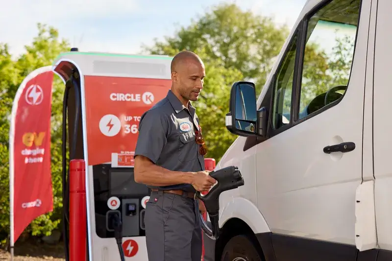 man charging his van at a Circle K station