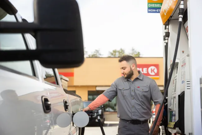 Man fueling his vehicle at a Circle K station