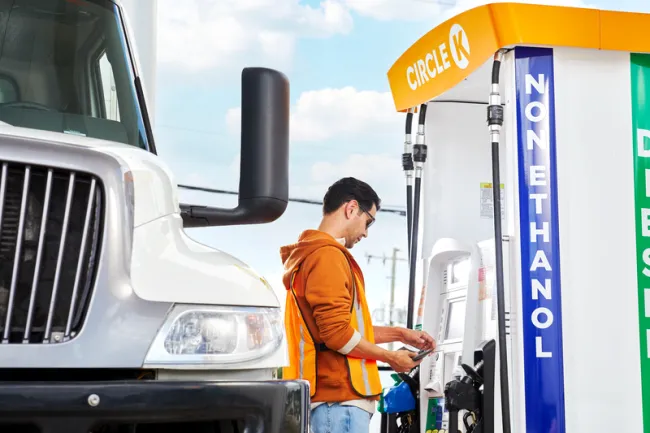 Man paying for fueling his truck
