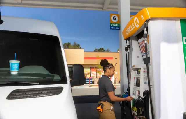 Woman paying with her Circle K Pro card, after fueling her vehicle at a Circle K station